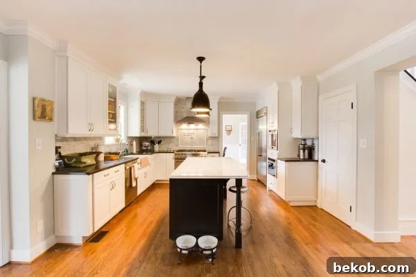 White Kitchen Renovation with Marble Island and Open Shelving