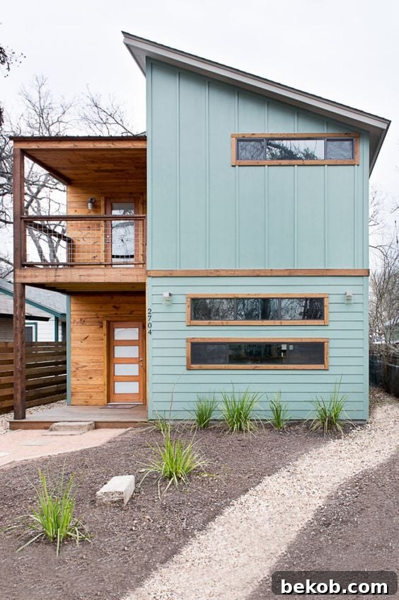 Elegant modern home with thoughtful landscaping and strong vertical elements