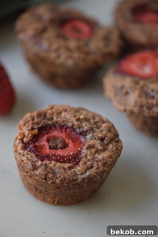 Try a twist on regular brownies with this yummy recipe for Strawberry Brownie Bites with The Recipe By Remodelaholic.com