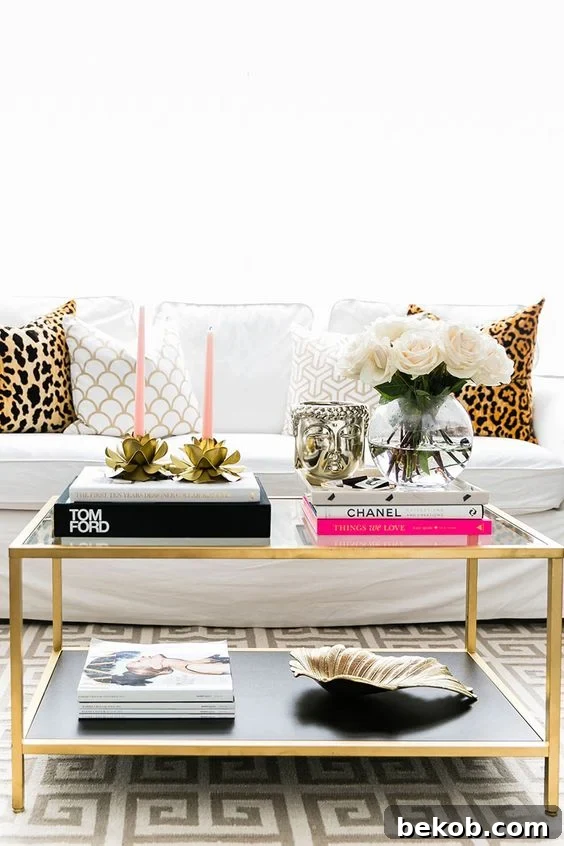 Adding a sculptural vase for height and visual interest on a coffee table.