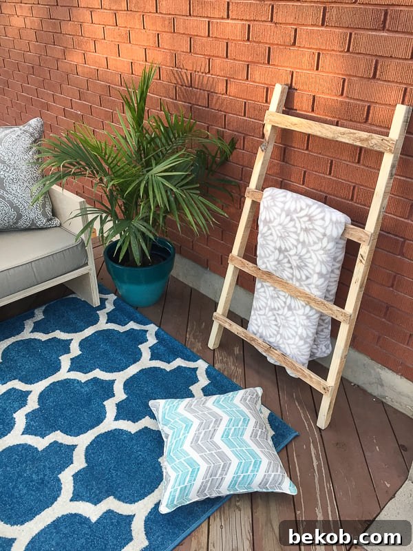 Pallet wood blanket ladder adding rustic charm to the outdoor space