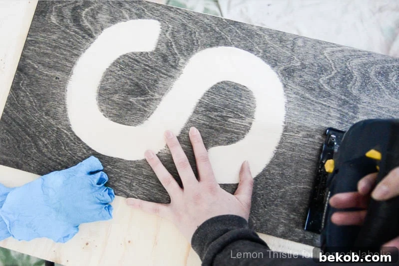 Rustic Stained DIY Plywood Monogram
Timeless Timber: A Personalized Plywood Monogram Project 9 Sanding the edges of the plywood sign