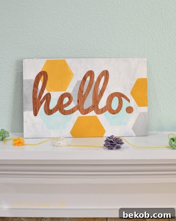 Clever Plywood Scrap Builds 6 A small plywood 'Hello' sign in a hexagon shape, offering a modern and welcoming decorative touch for any space.