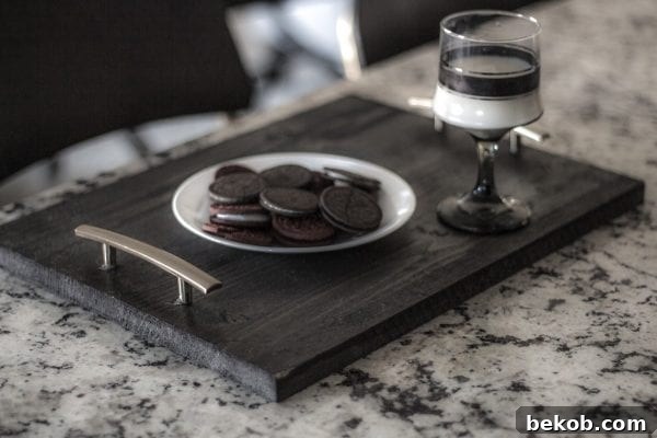 Build a functional and stylish DIY TV tray using plywood scraps, perfect for convenient snacking or laptop use.