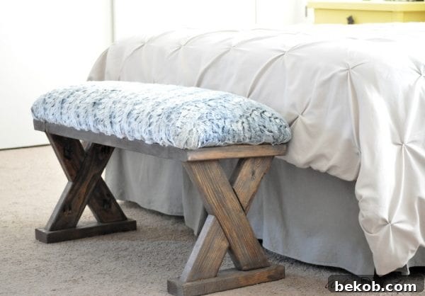 DIY upholstered X-bench from 2x4 boards. A chic and comfortable addition to any room, easily customized with fabric.