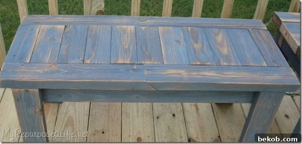 Simple reclaimed wood bench design from 2x4s, adding rustic charm to any space.