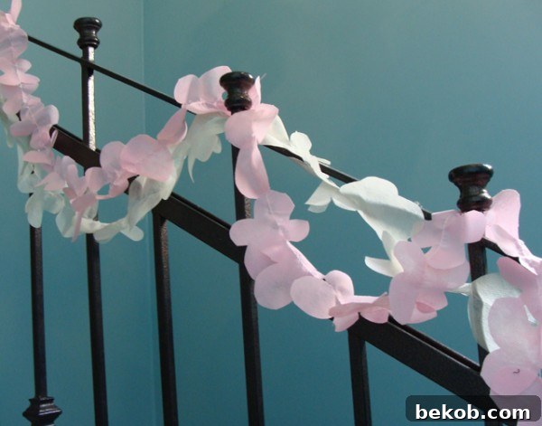 Close-up of a DIY spring flower garland made from disposable tablecloths, showcasing its delicate and translucent appearance.