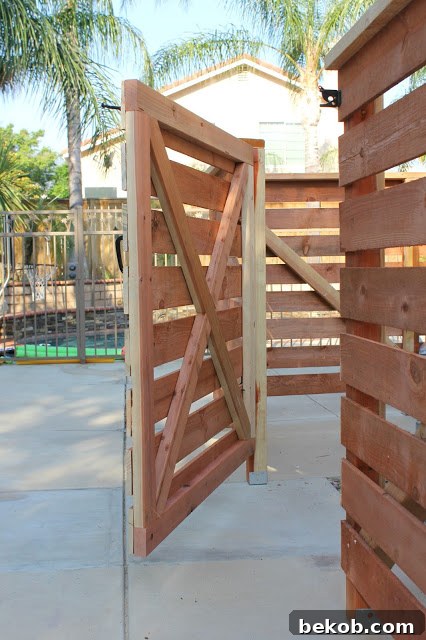 Sturdy Wooden Fence Covering Unsightly Pool Equipment