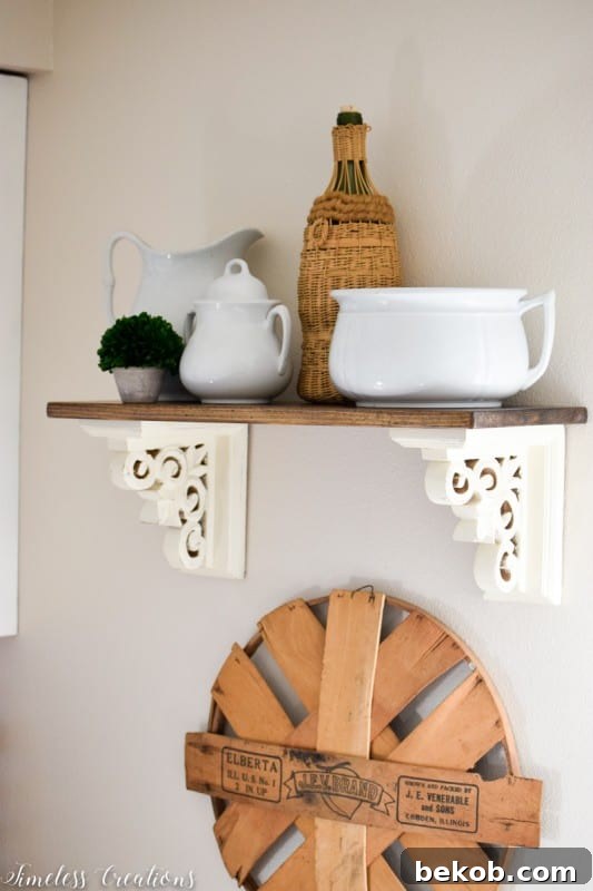 Kitchen shelf made from upcycled bookends found at TJ Maxx, featuring stylish decor
