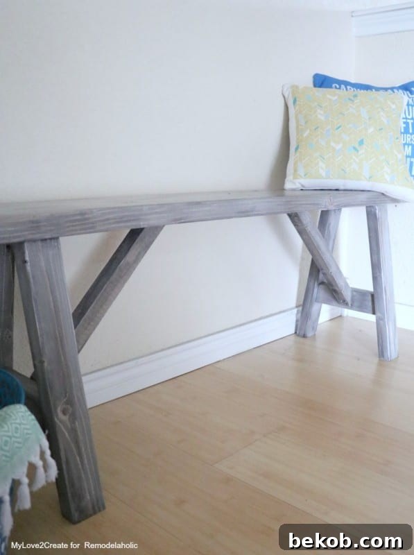 Easy DIY Farmhouse Wood Bench Plans by Remodelaholic, a long shot capturing its full beauty