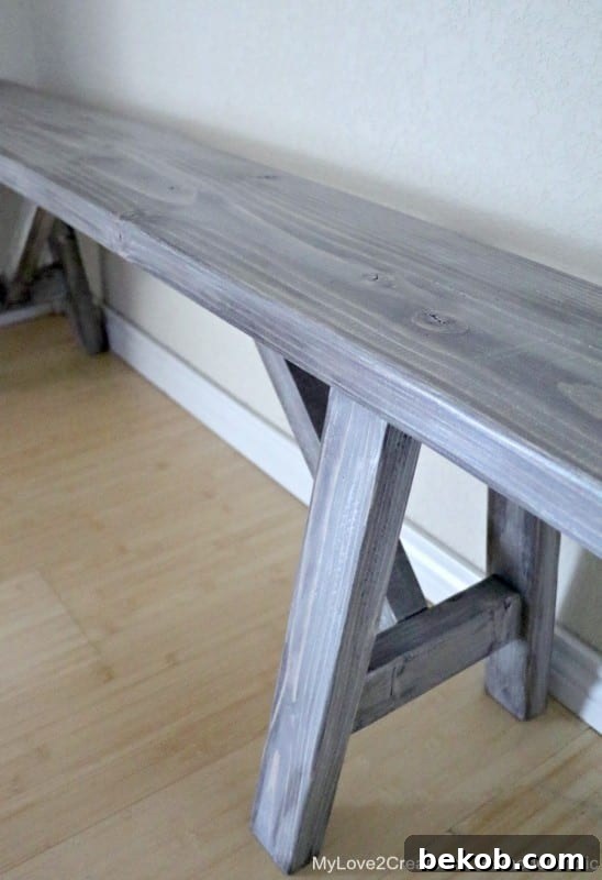 DIY wood bench plans featuring a beautiful farmhouse stain and rustic finish, showcasing the craftsmanship