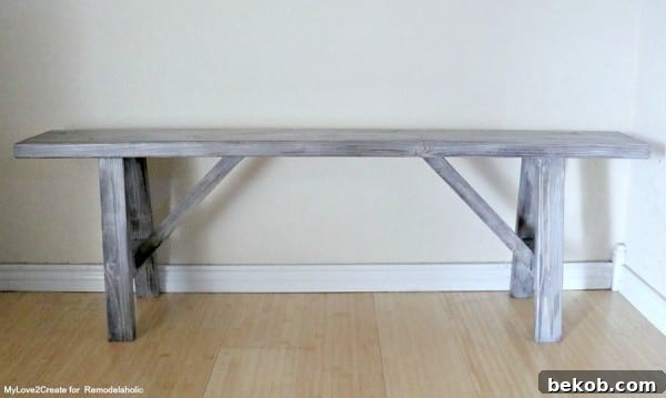 Easy DIY Wood Bench Plans and Tutorial by MyLove2Create, showcasing the completed project