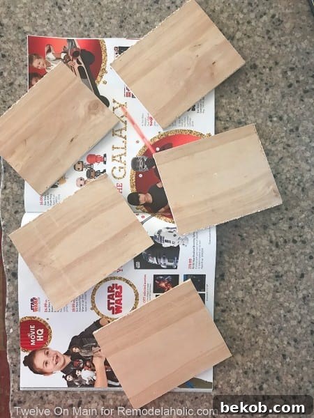 Small plywood squares painted with chalkboard paint, ready to be labels