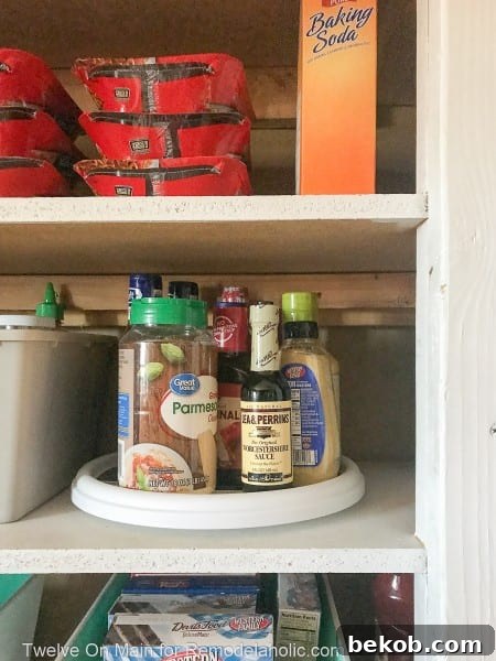 Organized condiments on a lazy Susan in the pantry