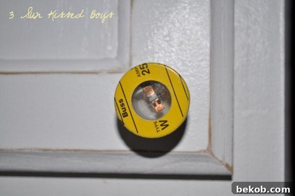 From all-white kitchen to colorful and fun with repurposed fuses as cabinet hardware by 3 Sunkissed Boys