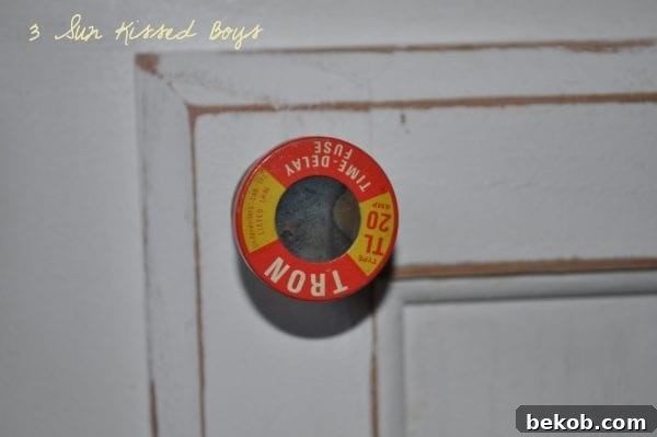 DIY kitchen cabinet update using reclaimed old fuses for unique hardware by 3 Sunkissed Boys