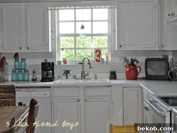 Add vibrant color to your kitchen on a budget with reclaimed old fuses as cabinet hardware by 3 Sunkissed Boys
