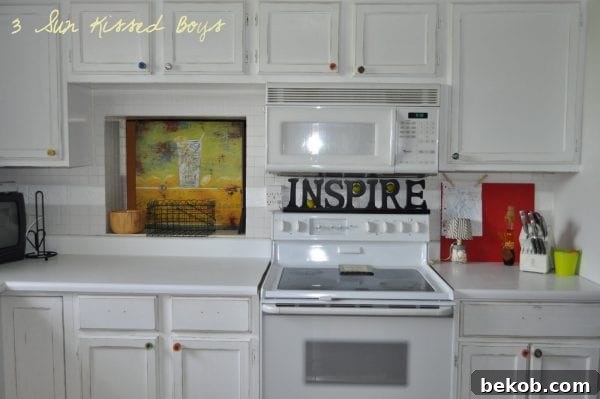 Color pop for an all-white kitchen with DIY repurposed fuse knobs, cheap renovation idea by 3 Sunkissed Boys