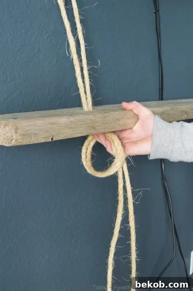 Threading rope through shelf board and tying knot