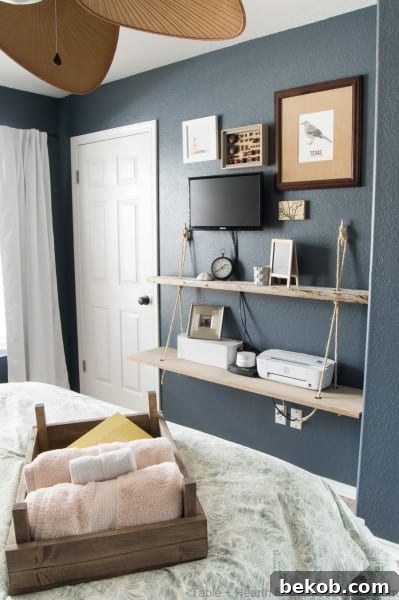 Guest room shelving and storage idea: DIY reclaimed wood floating rope shelf