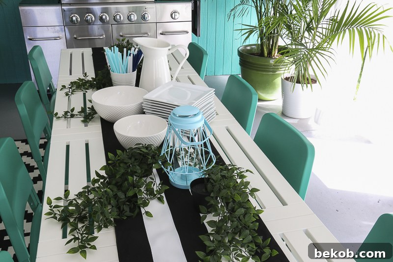 After: Outdoor Dining Room with IKEA Furniture. Close-up of table setting with white pitcher, colorful straws, and plants.