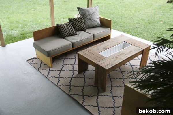 Close-up of Painted Concrete Patio with Outdoor Furniture and Greenery