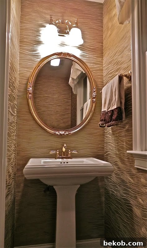 Powder room with bold metallic gold wavy wallpaper