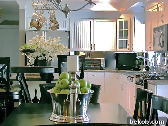 Original builder-grade kitchen with stark white cabinets