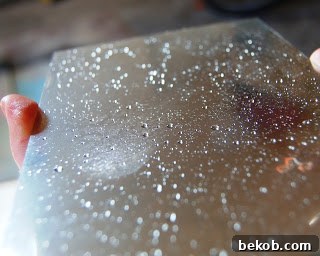 Vinegar-Water Solution Sprayed on Painted Glass