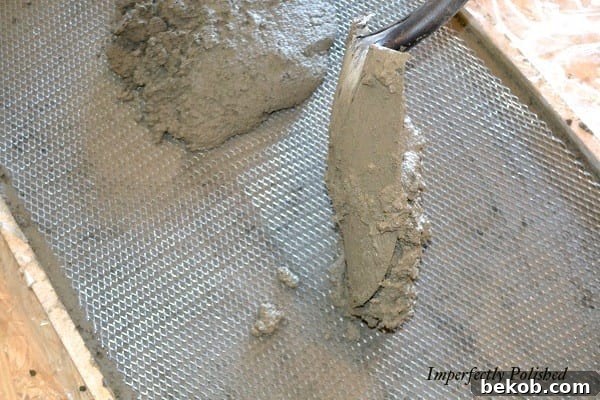 Shoveling Concrete Mix into the Forms