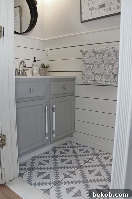 Bathroom floor tile ideas featuring floor stickers for a patterned look