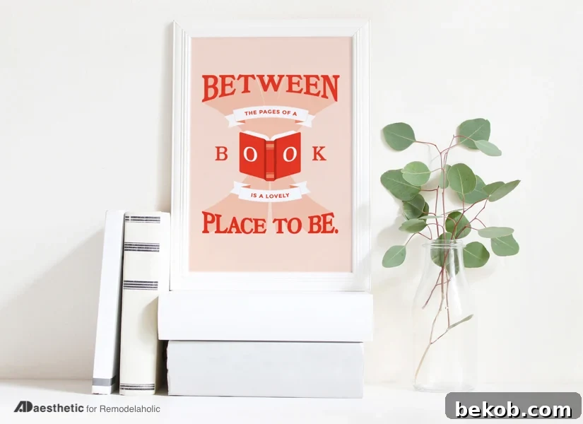 Horizontal free book art printable featuring 'Between the Pages of a Book is a Lovely Place to Be,' ideal for enhancing the decor of a library, office, or bedroom with easy, stylish art. From AD Aesthetic on Remodelaholic.