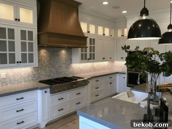 Modern White Kitchen with Farmhouse Accents: A dream kitchen designed by RC Dent Construction and Remedy Furniture and Design.