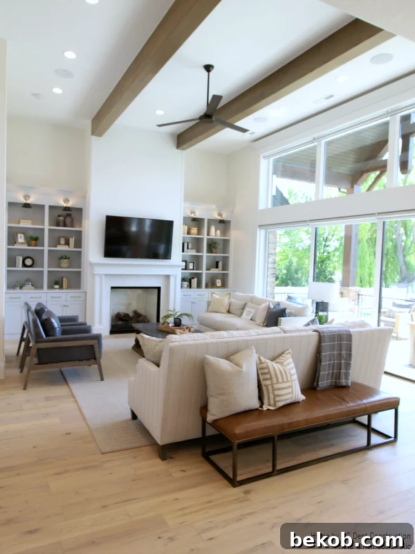 Neutral Family Room with Mixed Style Furniture: A timeless traditional home designed by RC Dent Construction and Remedy Furniture and Design.