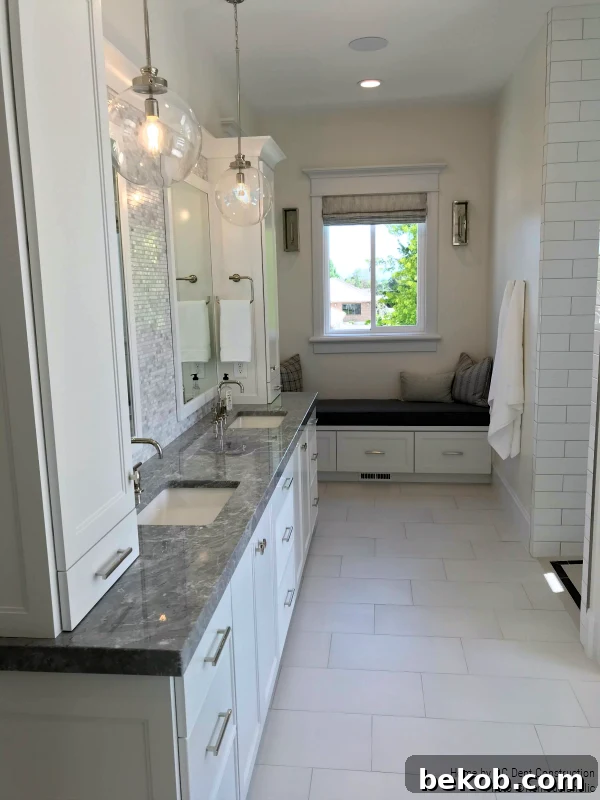Modern Master Bathroom in Gray and White: A timeless traditional master bathroom designed by RC Dent Construction and Remedy Furniture and Design.