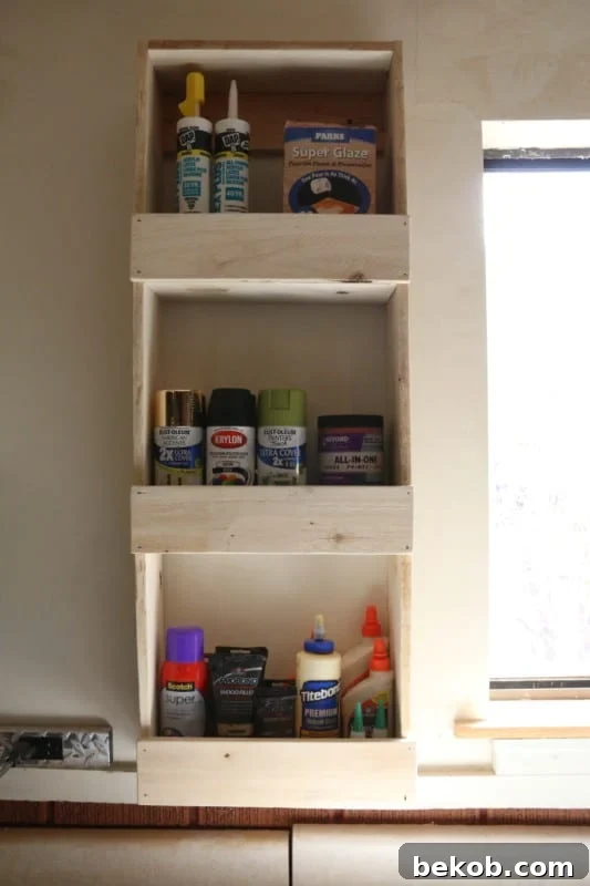 Easy To Build Rustic Wood Wall Bin For Garage Paint And Glue Storage #remodelaholic