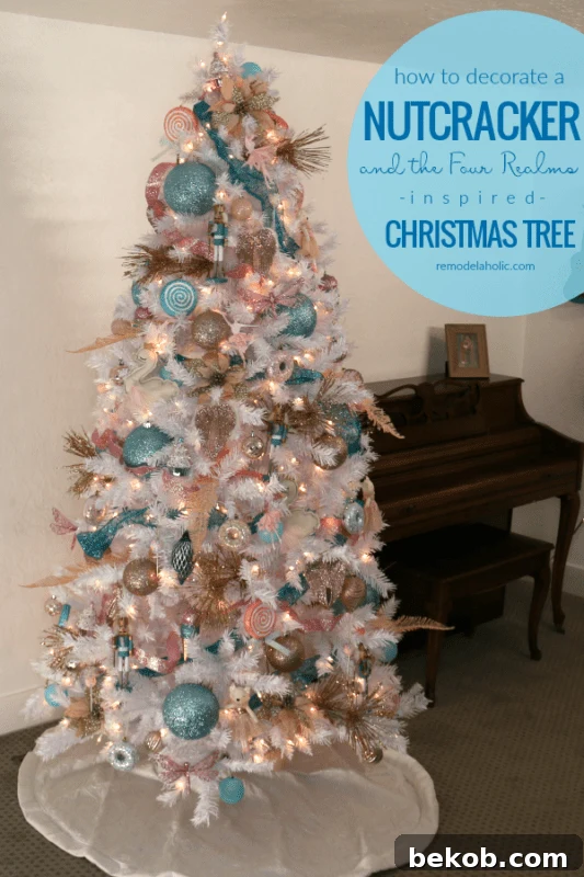 A dazzling Nutcracker-themed white Christmas tree adorned with pastel blue, blush pink, and rose gold ornaments. Featuring enchanting ballerinas, playful candy lollipops, miniature nutcrackers, and delicate wings, this elegant tree by Remodelaholic.com embodies a vintage-inspired Christmas. Discover how to create this magical, non-traditional Christmas decor. #remodelaholic #christmastree #christmasdecorating #nontraditionalChristmascolors #vintageChristmas #NutcrackerTree