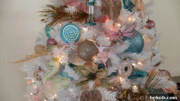 Cassity Remodelaholic's dazzling Nutcracker Christmas tree featuring blue, pink, and gold decor on a crisp white tree. Elegant and whimsical holiday inspiration for festive home decorating. #remodelaholic #christmastree #christmasdecor