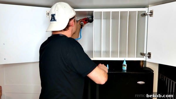 Glue And Nail Fridge Cabinet Organizer Divider Pieces In Place #remodelaholic