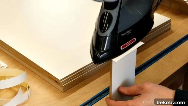 How To Iron On Edge Banding For IKEA Hack Cabinet Organizer #remodelaholic