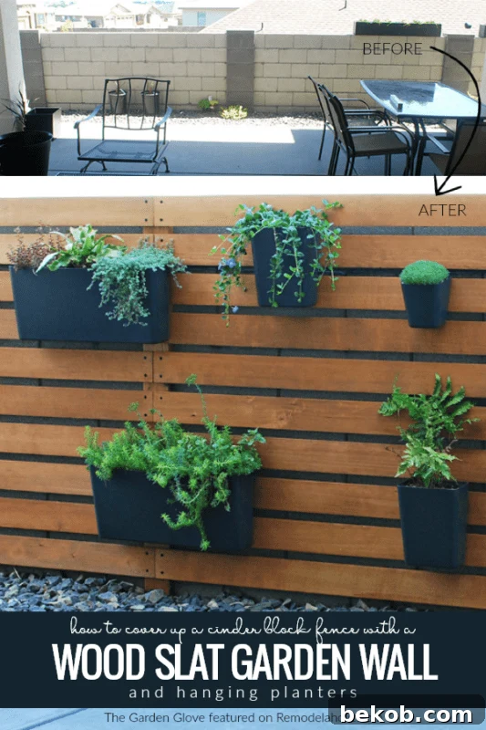 How to cover up a cinder block fence with a wood slat garden wall with vertical hanging planters, The Garden Glove featured on Remodelaholic.com
