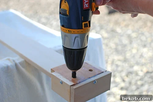 DIY Jig To Attach Wood Boards To A Concrete Block Fence For A Garden Planter Wall, The Garden Glove Featured On Remodelaholic