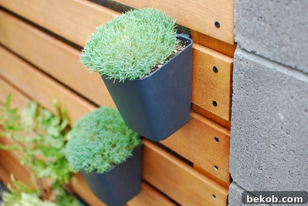 IKEA Sunnersta And Variera Kitchen Organizers As Planters On A Wood Slat Garden Wall, The Garden Glove Featured On Remodelaholic