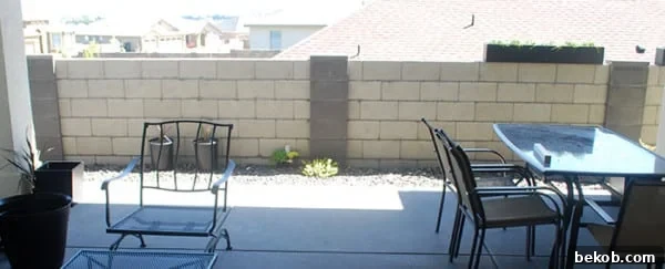 Cinder Block Fence Before Upgrade To Wood Slat Planter Wall, The Garden Glove Featured On Remodelaholic