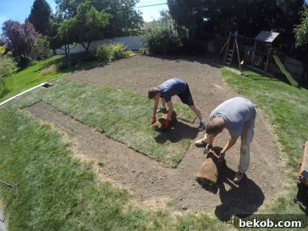 Unrolling Sod Pieces #remodelaholic How To Lay Sod Yourself