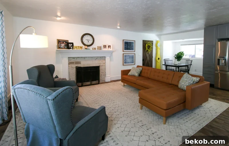 Open concept floorplan living room before the DIY fireplace makeover showcasing potential