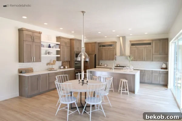 White spindle chairs in a neutral wood kitchen