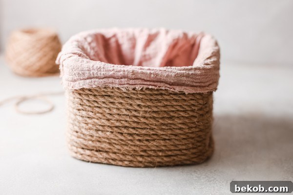 Pink fabric lining in a handmade upcycled storage basket, perfect for organizing
