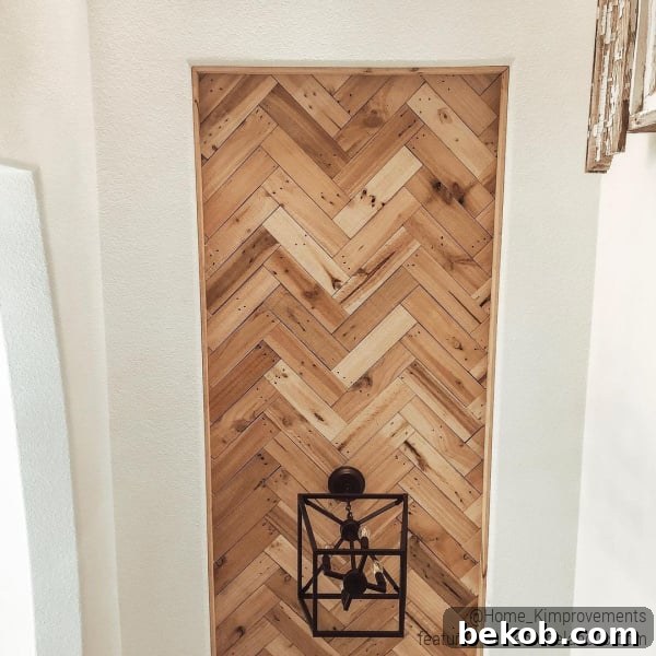 Modern farmhouse entryway with a DIY herringbone pallet wood ceiling in an inset tray ceiling, creating a rustic yet elegant focal point.