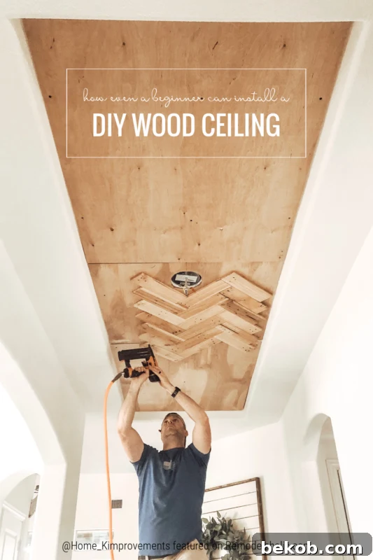 Pin graphic for a beginner-friendly DIY project to update a tray ceiling with reclaimed pallet wood, showcasing a herringbone pattern.